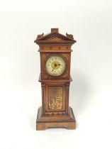 Miniature apprentice mahogany table clock in the form of a longcase clock circa late 19th / early