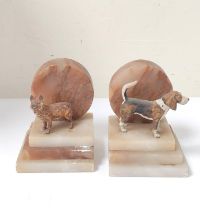 Pair of Art Deco onyx and cold painted dog bookends, 12cm high, 10cm wide. (2)