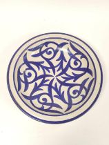 Arts & Crafts crackle glaze large shallow bowl, with all-over Persian inspired blue painted stylised