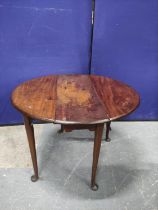 Mid 18th century mahogany table with oval top (one flap possibly replaced) upon tapering circular