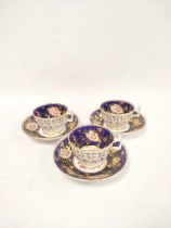 Three early 19th century porcelain cabinet cups and saucers, decorated with hand painted pink