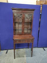 Georgian mahogany bonheur de jour with folding writing surface enclosing a pair of recessed