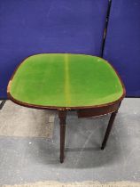 Early 19th century mahogany card table of almost semi-circular shape with tulipwood crossbanding