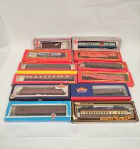 Twelve boxed 00 gauge rolling stock carriages to include a Bachmann Branchline 34-701 BR Standard