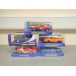 Scalextric. Five 1/32 scale racing car models in perspex cases to include Porsche 997 C2871, Ford