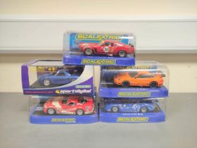 Scalextric. Five 1/32 scale racing car models in perspex cases to include Porsche 997 C2871, Ford