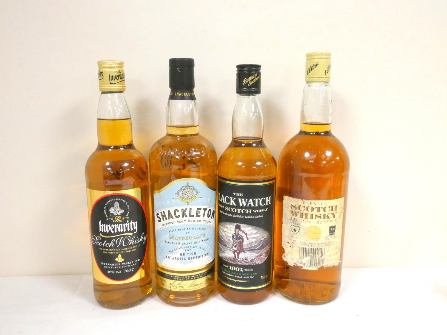 Four bottles of blended Scotch whisky to include INVERARITY 70cl 40% abv. THE BLACK WATCH 70cl 40%