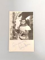 Roger Moore signed cinema promo card 13.5cm x 8.3cm