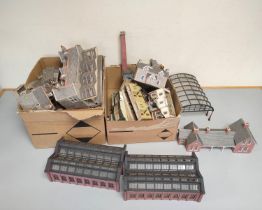 Two boxes of model railway buildings and track components to include a factory, glass station roof