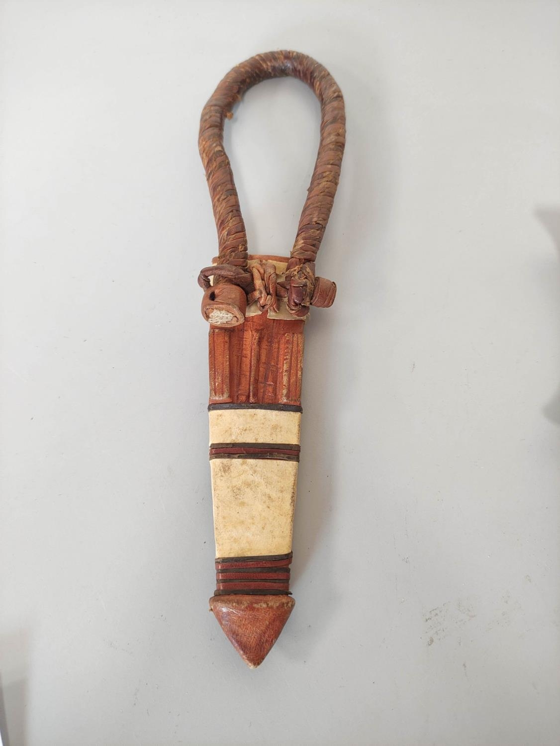 A Sudanese arm knife with tapering straight blade and carved wooden hilt. Contained in tooled - Image 6 of 6