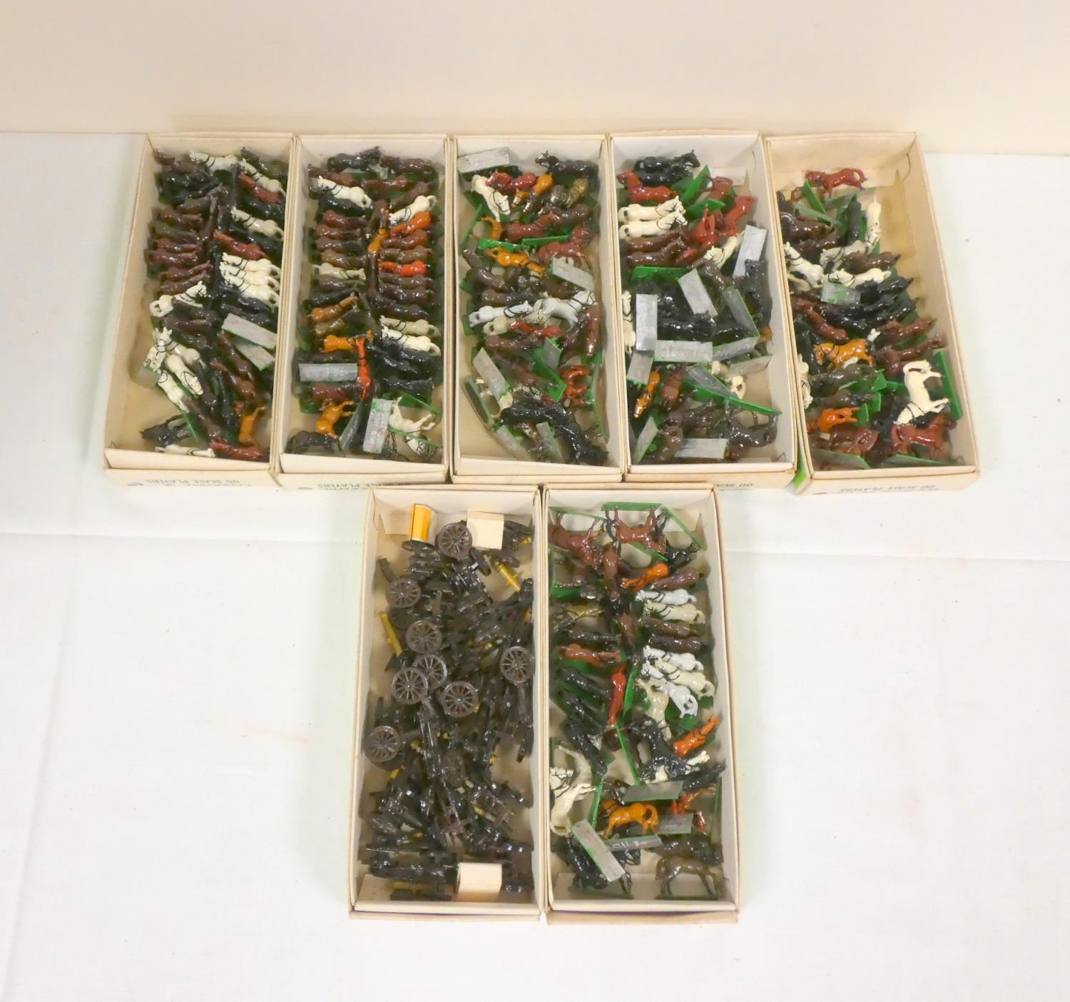Collection of painted lead figures comprising of horses and gun carriages.