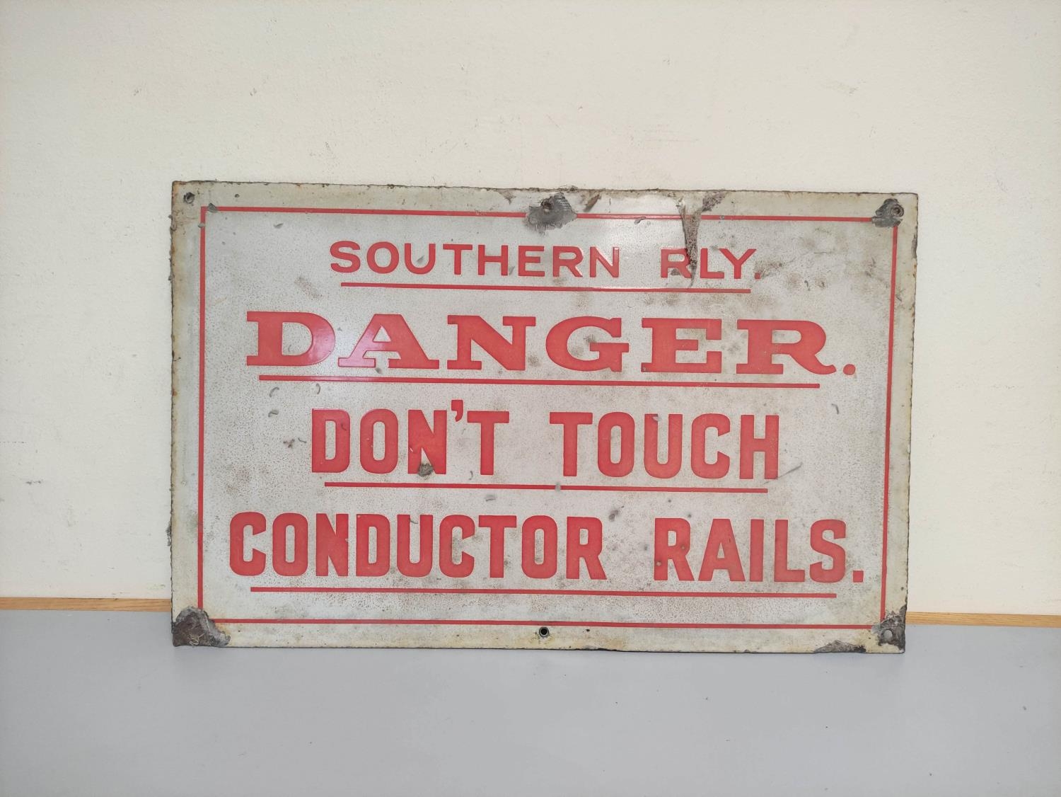 Southern Railway enamel sign, red lettering on a white ground, inscribed ''Southern Railway Don't
