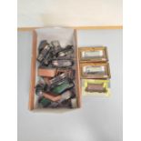Box containing a collection of 00 gauge rolling stock to include Esso tankers, covered wagons and