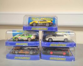 Scalextric. Five 1/32 scale racing car models in perspex cases to include Porsche 997 C3079,