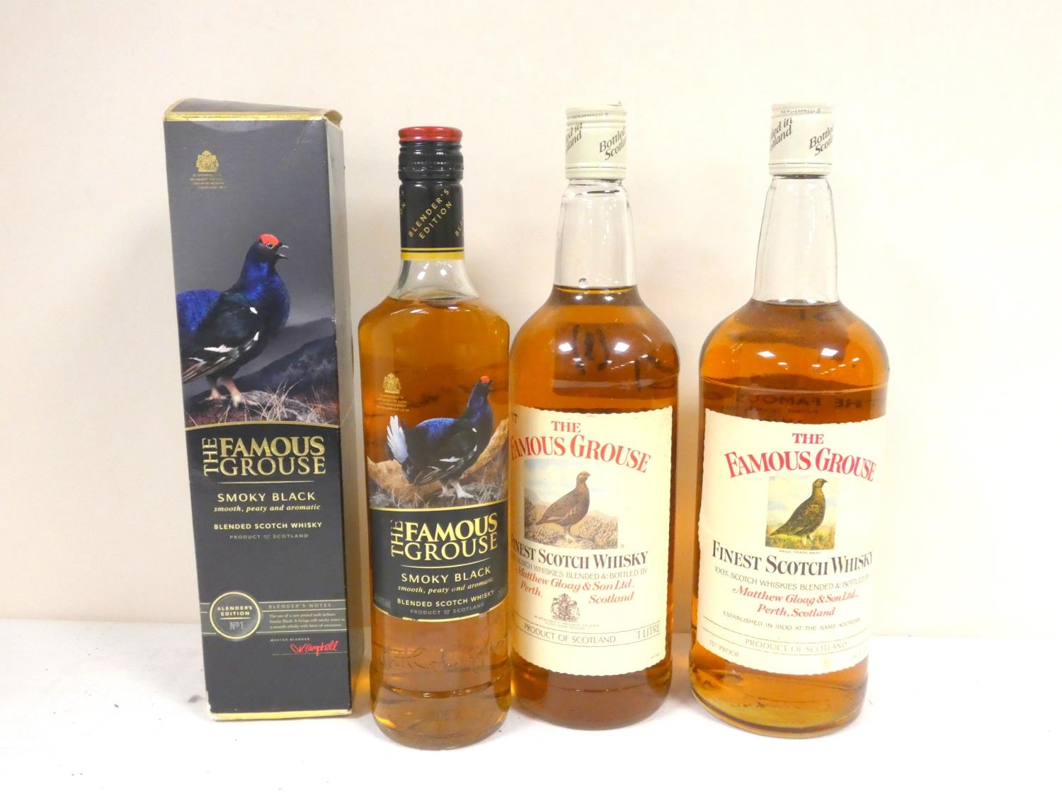 Three bottles of blended Scotch whisky to include THE FAMOUS GROUSE 75° proof 40 fl ozs, THE