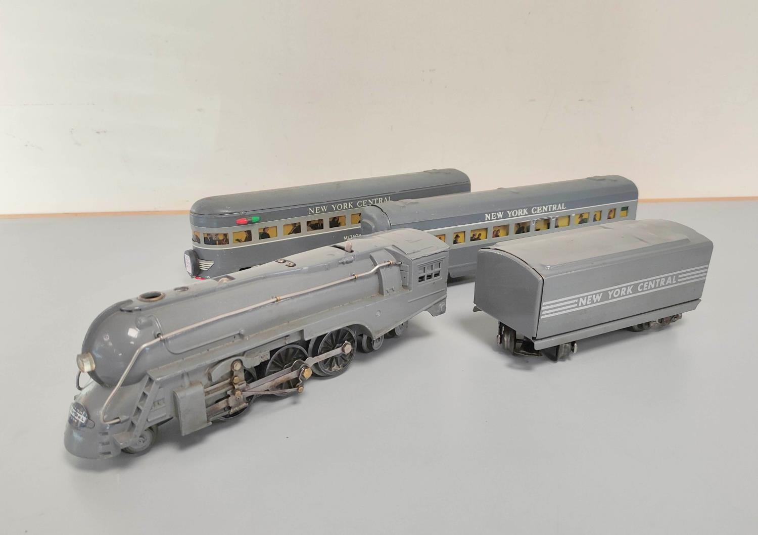 Lionel. 0 gauge Dreyfuss J3 Hudson locomotive in New York Central grey livery. Also three