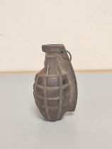 US Mk. II pineapple training grenade of cast iron construction inscribed ''Korea'' above spoon.