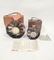 Two early 20th century air speed meters in leather cases the smallest measuring 10cm in diameter and