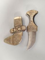 Early 20th century Arabic unmarked white metal Jambiya dagger with repousse mounts and horn handle.