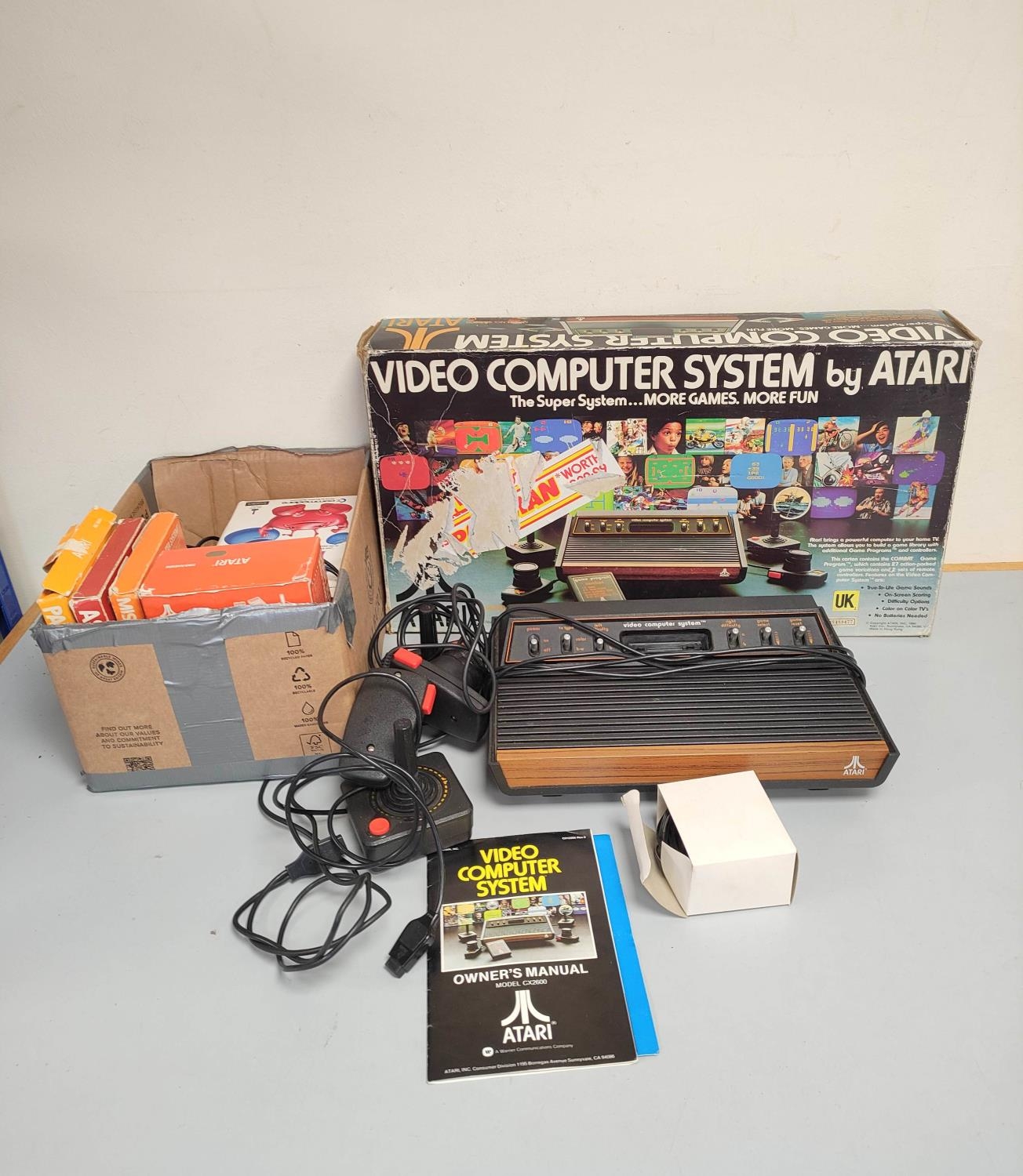 Boxed Atari video computer system, model CX-2600A with accessories and games to include Missile