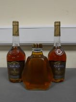 Two bottles of Martell V.S fine cognac, 70cl, 40% vol, with a glass decanter containing amber