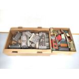 Two boxes of model railway buildings and track components to include a church, station building,