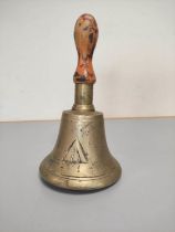 A British military gas warning hand bell with broad arrow.