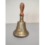 A British military gas warning hand bell with broad arrow.