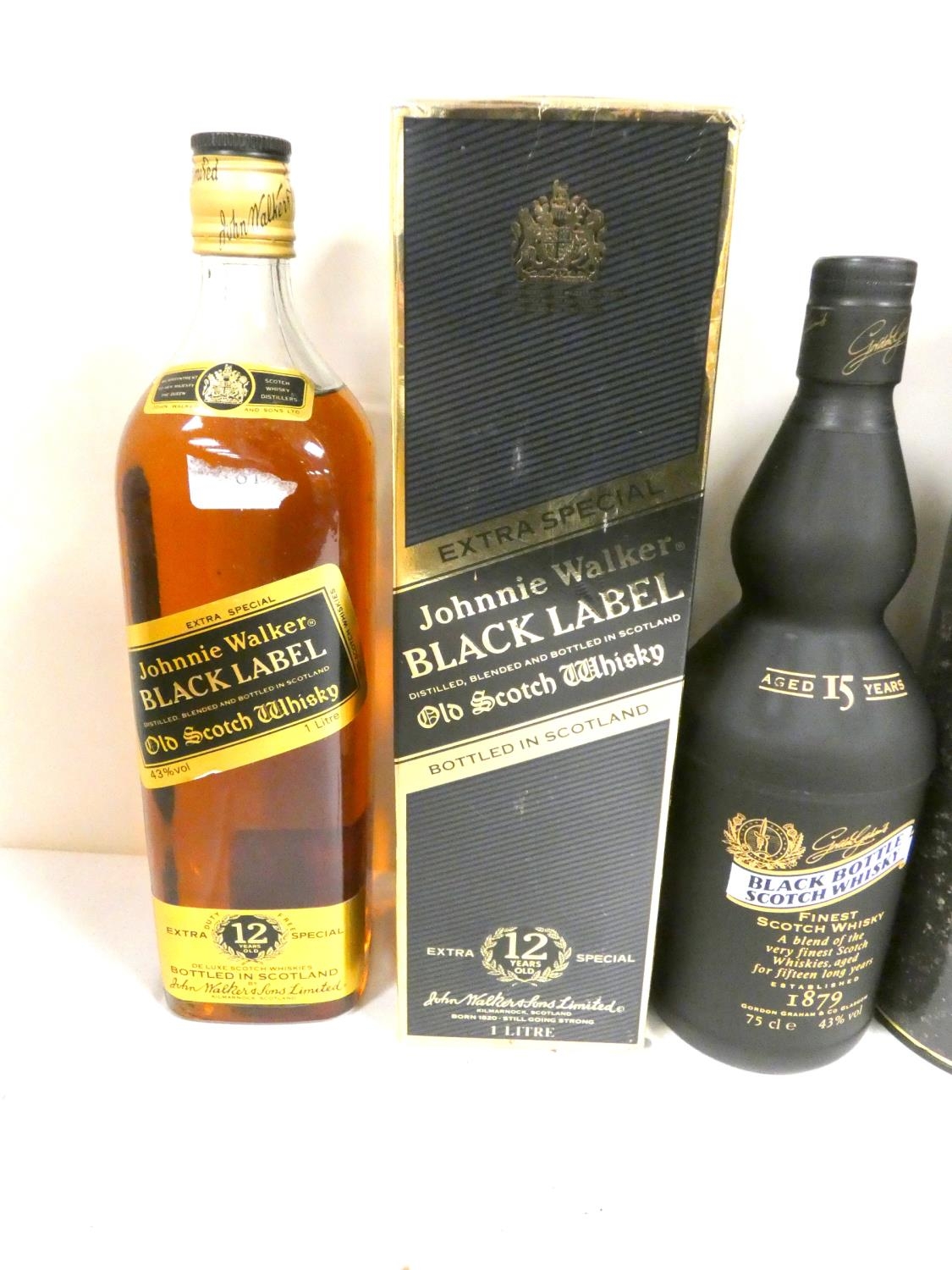 Four bottles of blended Scotch whisky to include BLACK BOTTLE 15 year old 43% abv. 75cl, JOHNNIE - Image 2 of 6