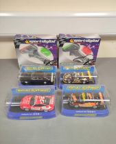 Scalextric. Four 1/32 scale racing car models in perspex cases to include a Porsche 997 C2899, a