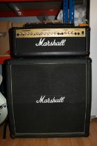 Marshall guitar speaker cabinet and a Marshall amplifier head G100R model.