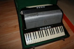 Frontalini cased Accordion.