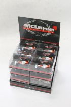 Pauls Model Art Micro Champs shopkeepers display stand containing twenty-four 1:64 scale McLaren