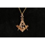 9ct gold Masonic pendant in the form of a crossed compass and square with 'G' in the centre, by
