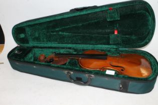 Violin having two piece back, no interior label, in fitted case.