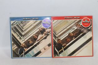 The Beatles 1962-1966 on red double vinyl and The Beatles 1967-1970 on blue double vinyl.