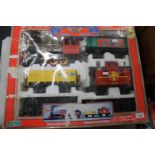 Echo G Scale twenty-piece train set boxed, and a Mamond live steam road roller. (2)