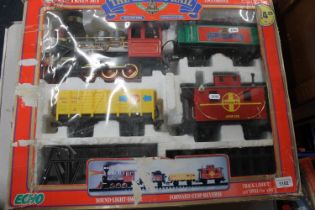 Echo G Scale twenty-piece train set boxed, and a Mamond live steam road roller. (2)