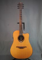 LAG Tromontone six string acoustic guitar, model number 300DCE.