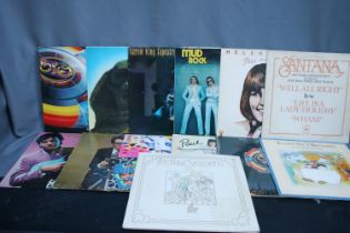 Box containing a quantity of records mainly from the 70's to include ELO, Santana, Yes, Cat Stevens,