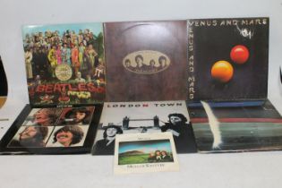 Beatles and Beatles related records to include Let It Be, Love Songs, Wings Over America, etc (7)