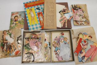 Vintage mid-century paper and card doll dressing up ephemera including dolls and outfits and