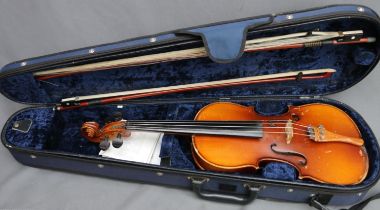 Cased students violin with two bows, made in China.