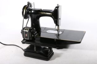 Singer model 222K sewing machine, numbered to the base 'EM602093', in original case.