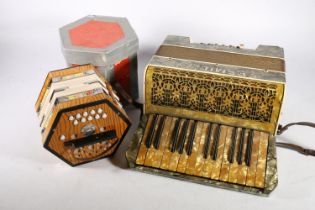 Boxed Concertina made in German Democratic Republic and a Fremielio accordion (2).