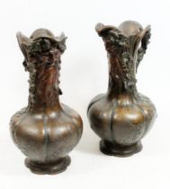 After Charles Georges Ferville-Suan (French 1847-1925), a pair of bronzed spelter ewers, the cast