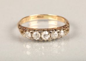 18ct yellow gold five stone diamond ring, the central stone slightly larger than 0.1cts, ring size
