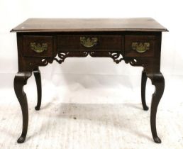 George III oak lowboy, the moulded rectangular top over three frieze drawers with brass handles