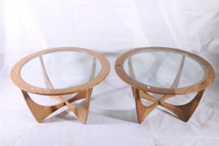 Pair of G-Plan Astro coffee tables, c1960s, the upswept teak supports with round frame