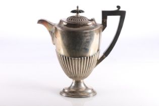 George V silver coffee pot of half lobed form with shaped ebony finial and angular handle, Walker
